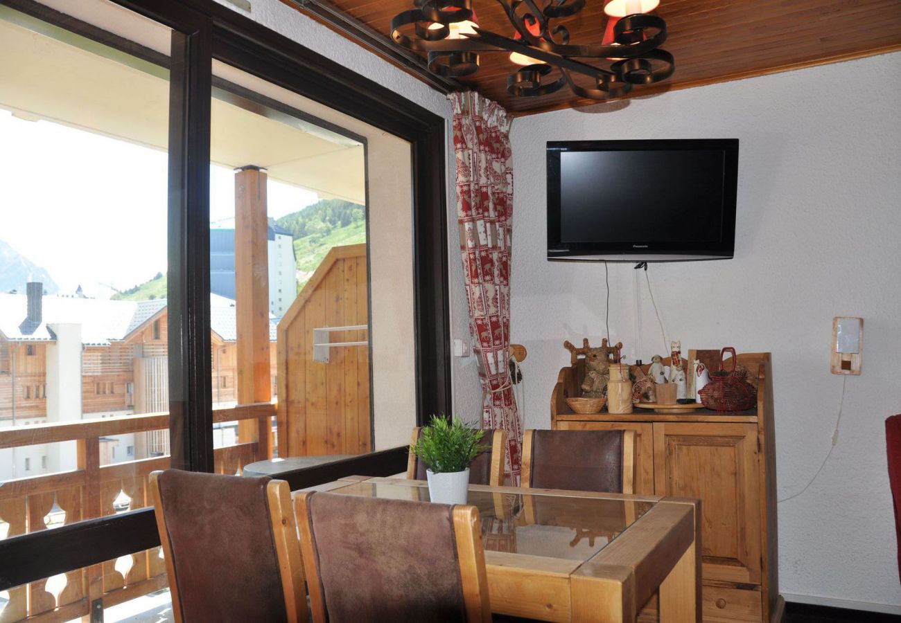 Living room with a direct access to the balcony, mountains view